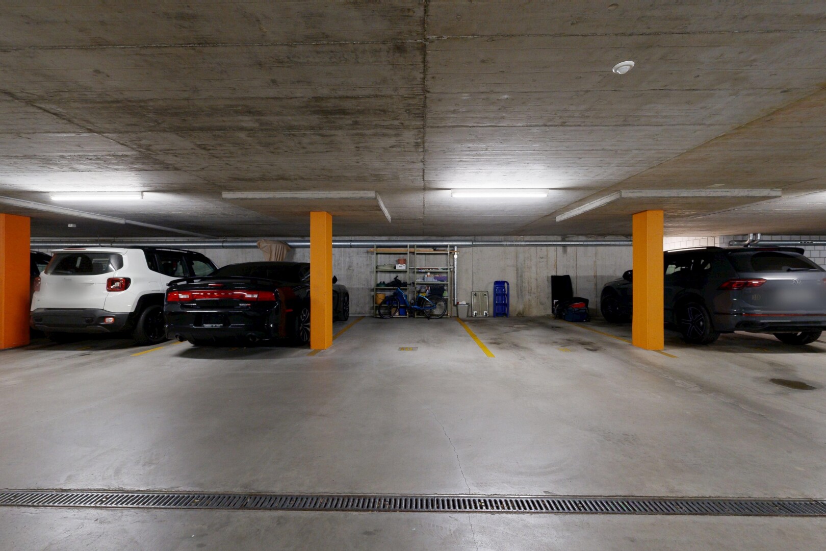 view of parking featuring a parking deck