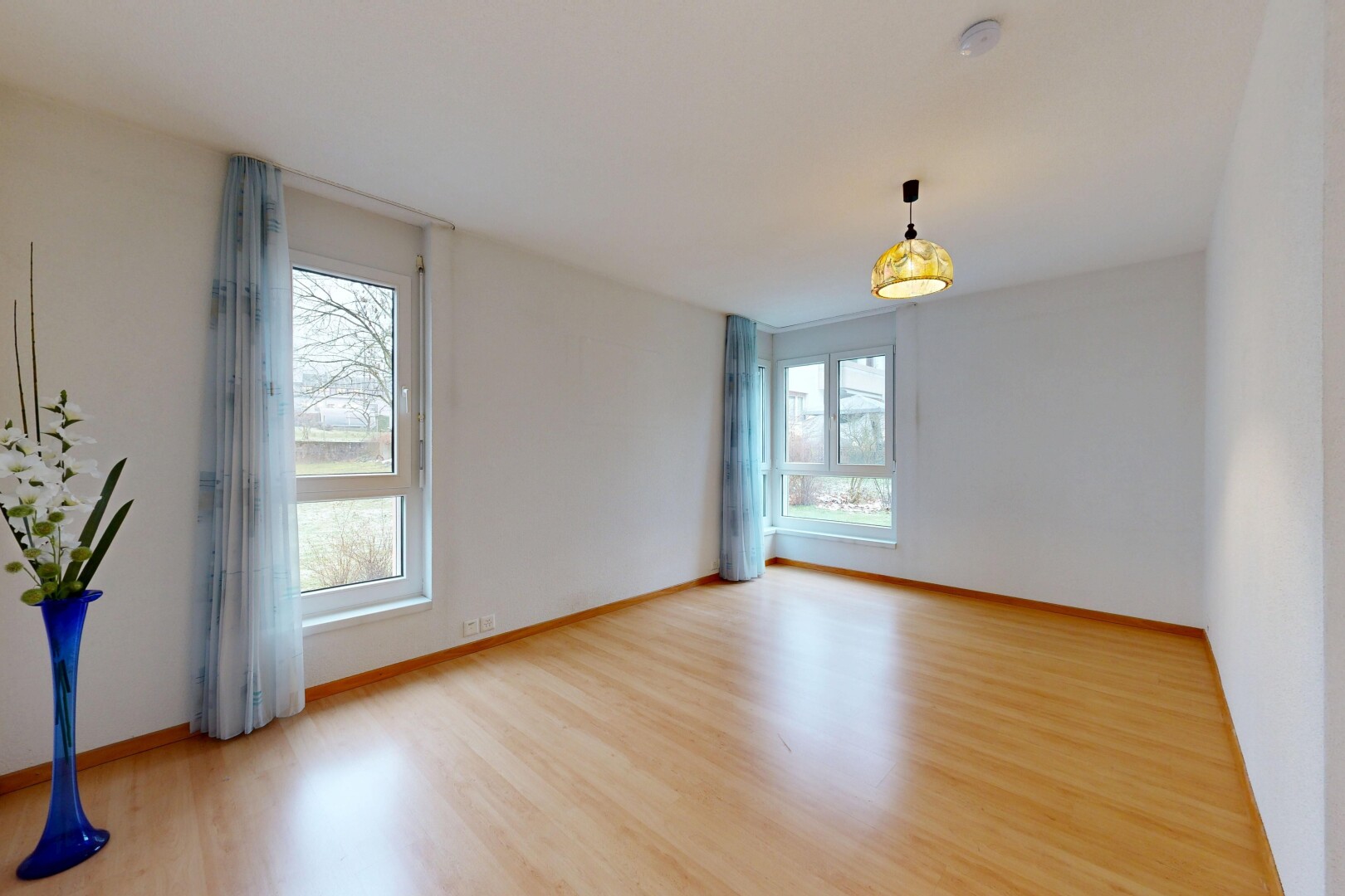unfurnished room featuring light wood-style floors and baseboards