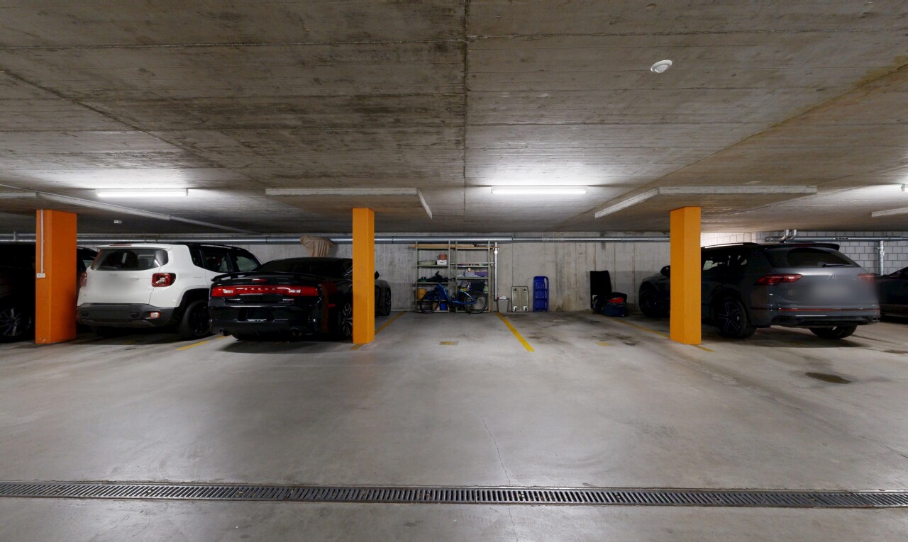 view of parking featuring a parking deck