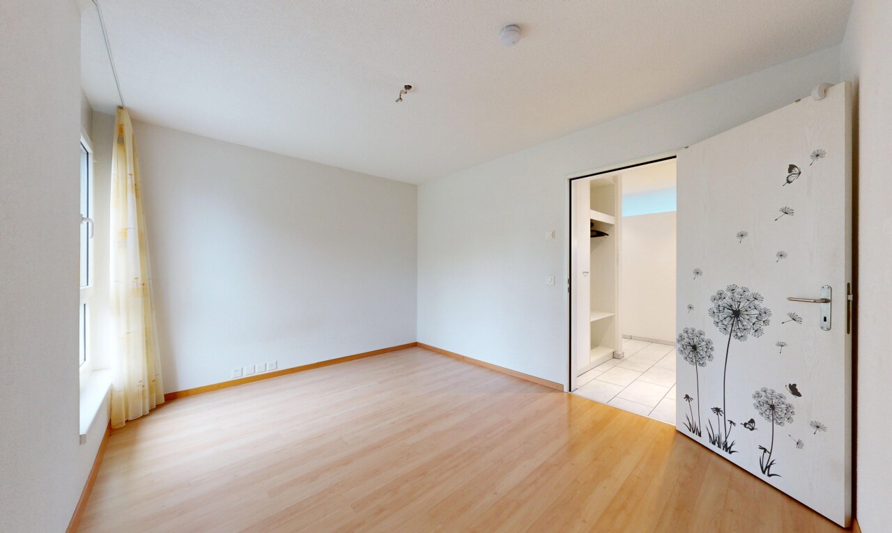 empty room featuring light wood-style floors and baseboards