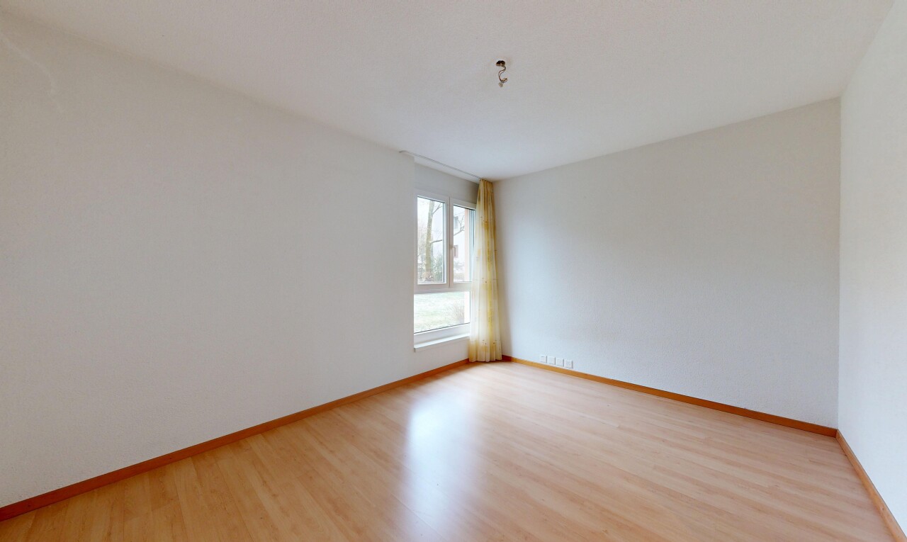 unfurnished room with light wood finished floors and baseboards