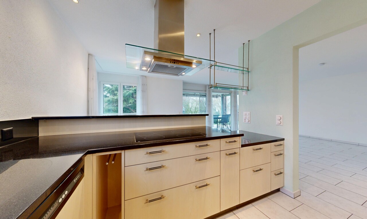 kitchen with island exhaust hood, dishwasher, black electric stovetop, and dark stone counters