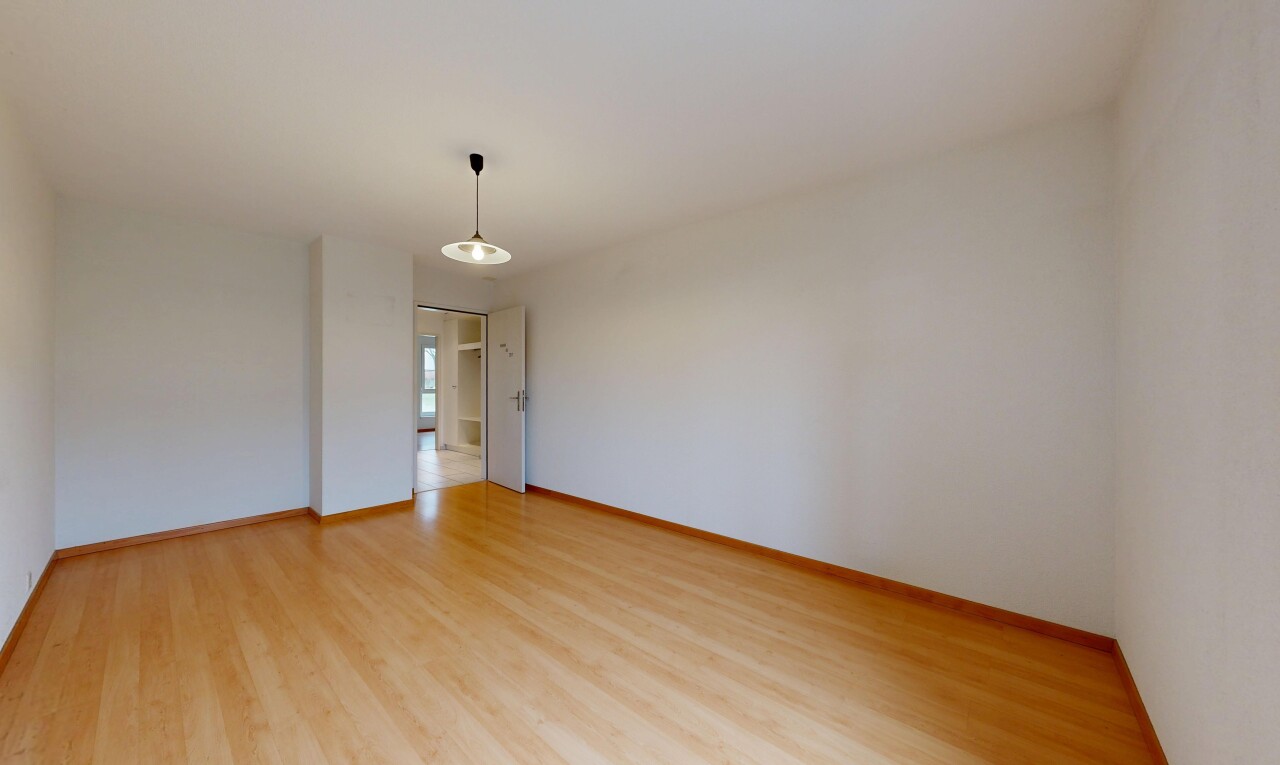 unfurnished room featuring light wood-style flooring and baseboards