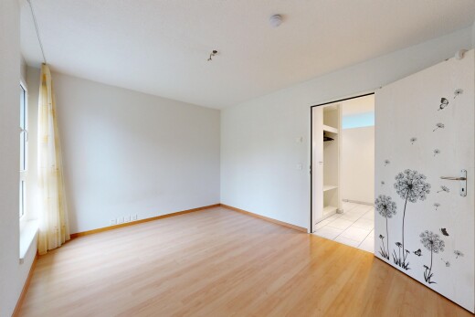 empty room featuring light wood-style floors and baseboards