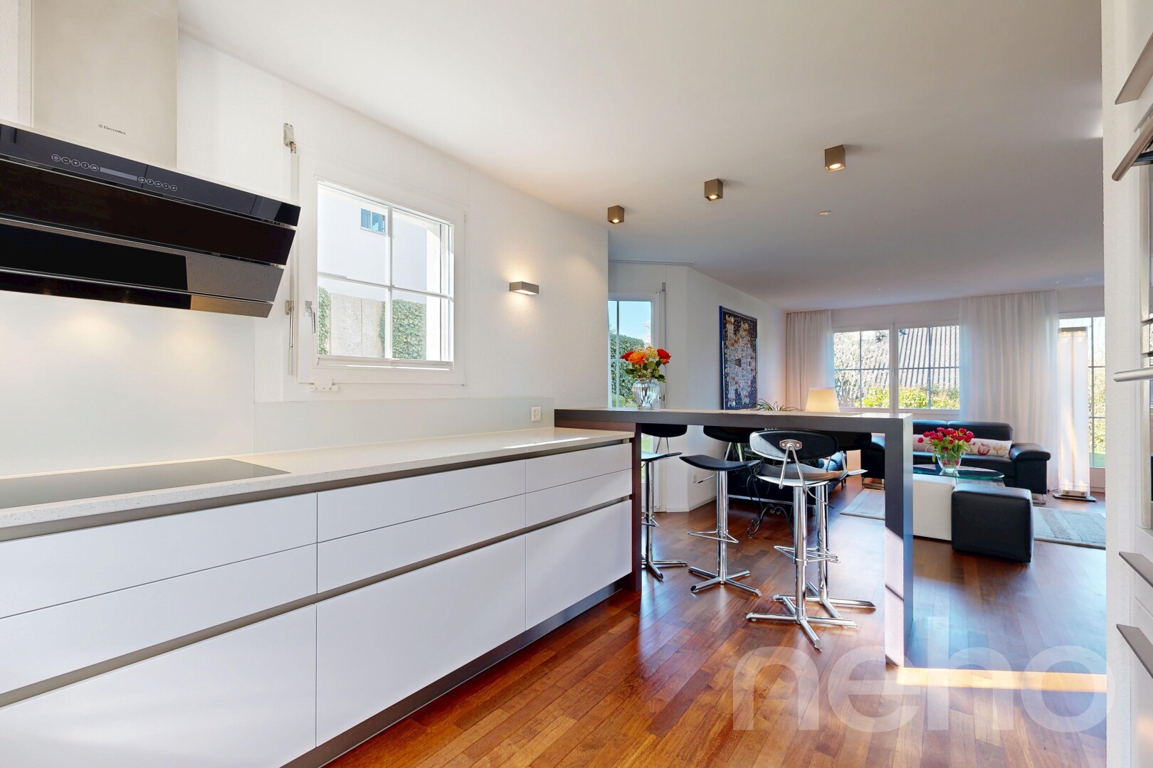kitchen featuring white cabinets, light countertops, dark wood finished floors, and plenty of natural light