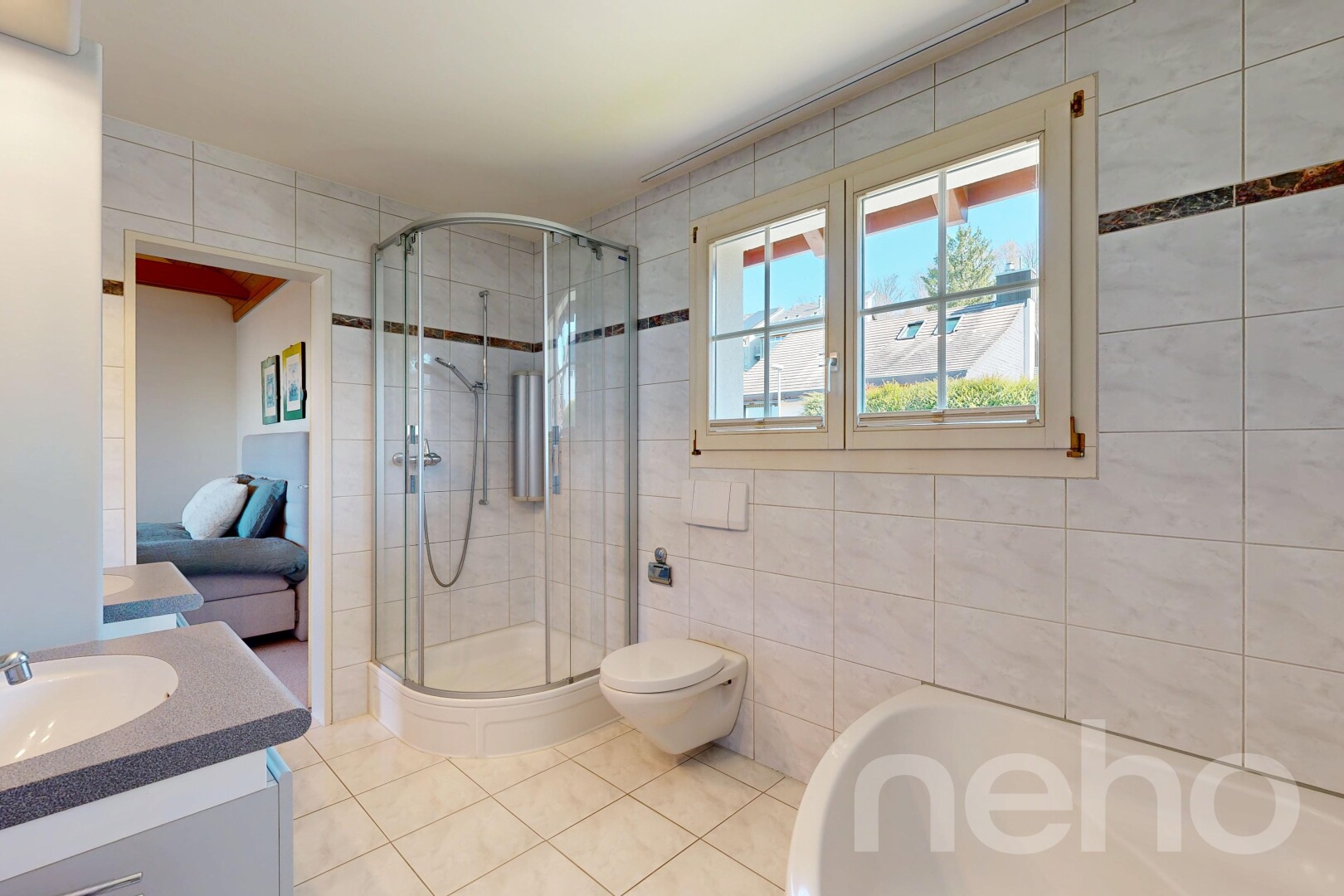 full bathroom with tile walls, vanity, a stall shower, ensuite bathroom, and light tile patterned floors