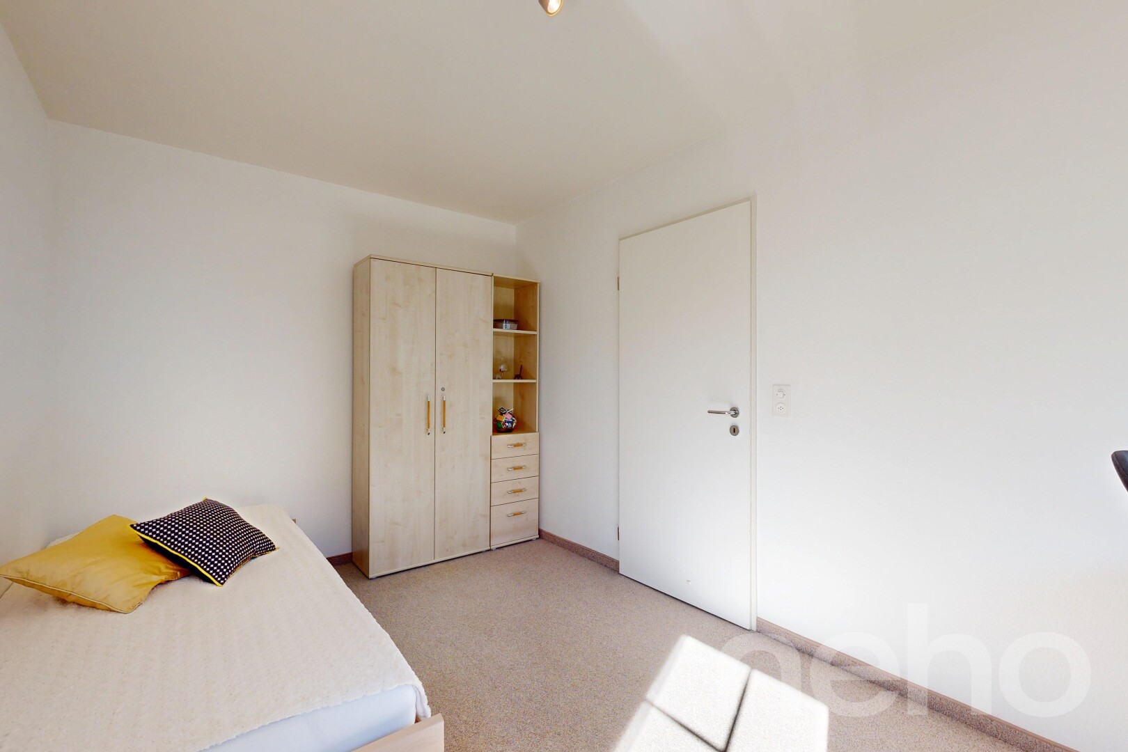 room / bedroom featuring light carpet and a closet