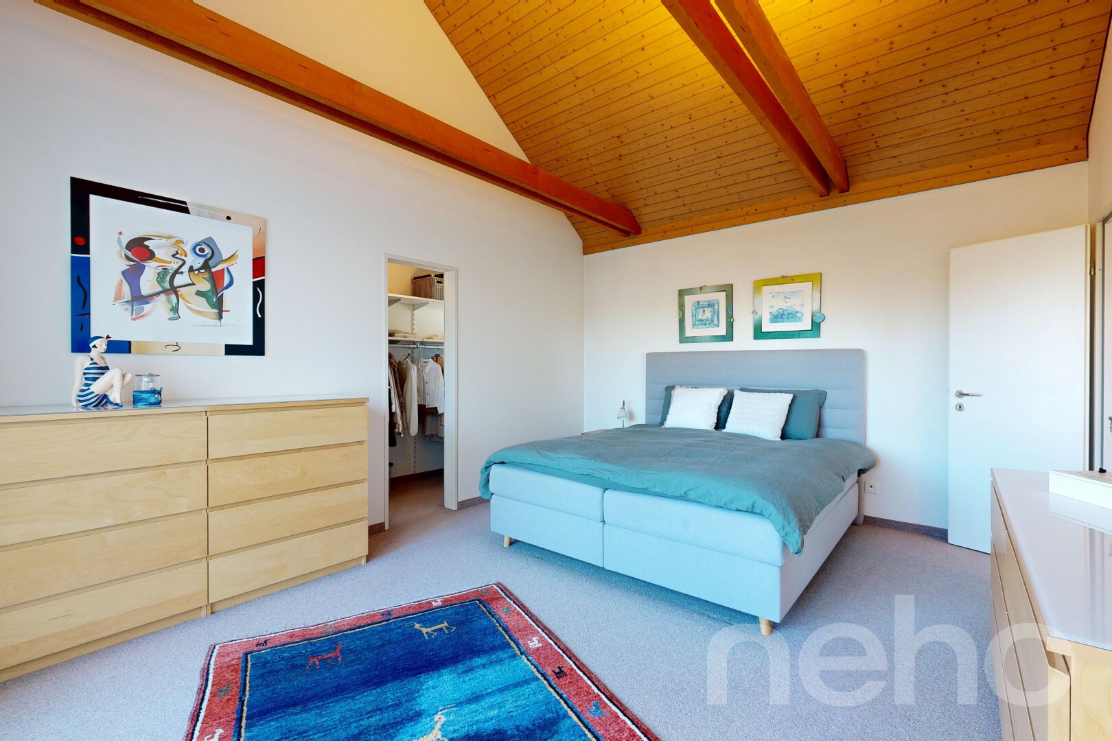 room with light colored carpet, vaulted ceiling with beams, a spacious closet, and wooden ceiling