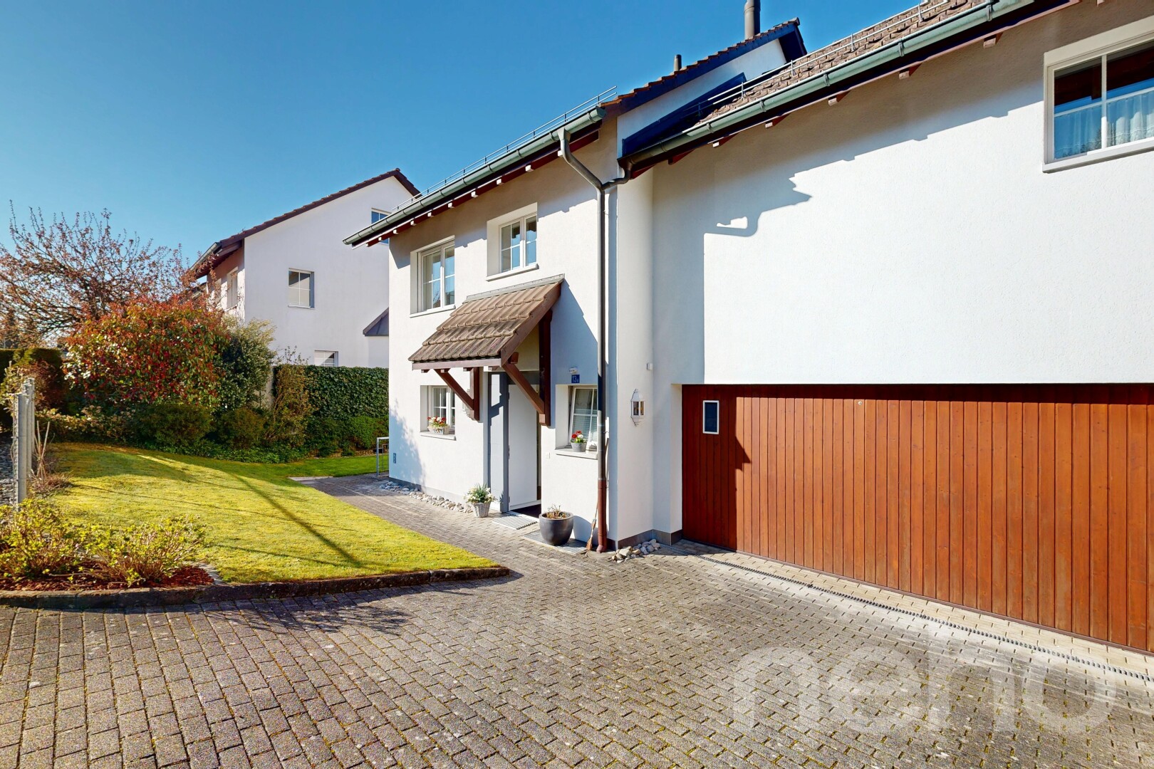 outdoor house with a yard and stucco siding