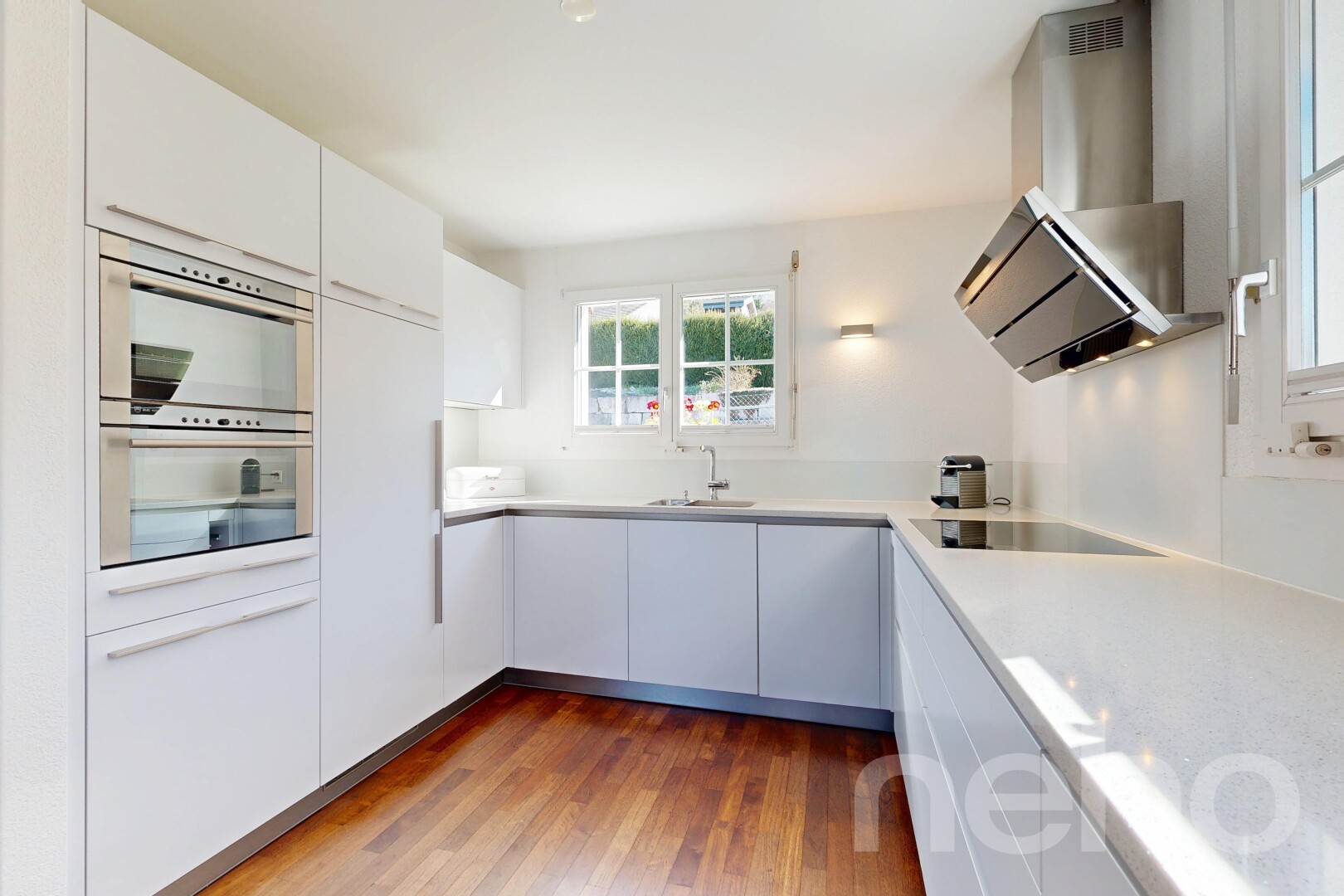 kitchen featuring dark wood finished floors, white cabinetry, light countertops, modern cabinets, and black electric stovetop