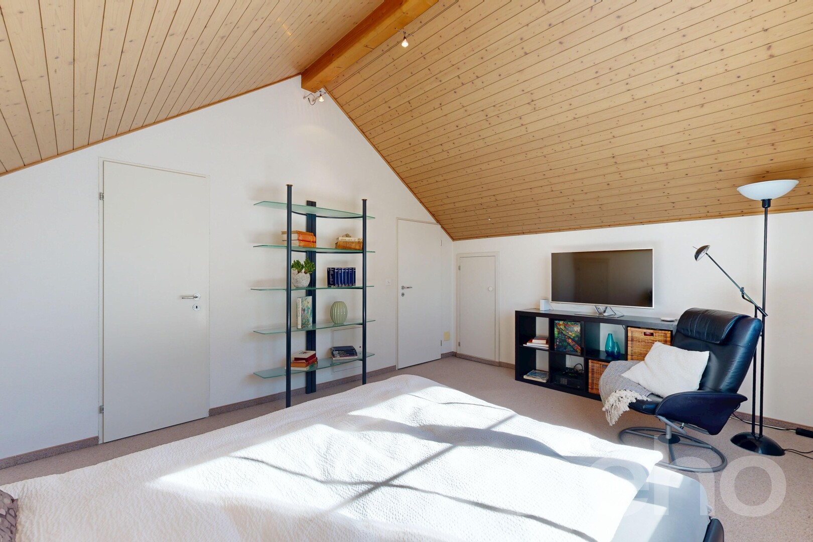 room featuring a wood ceiling with exposed beams and light colored carpet
