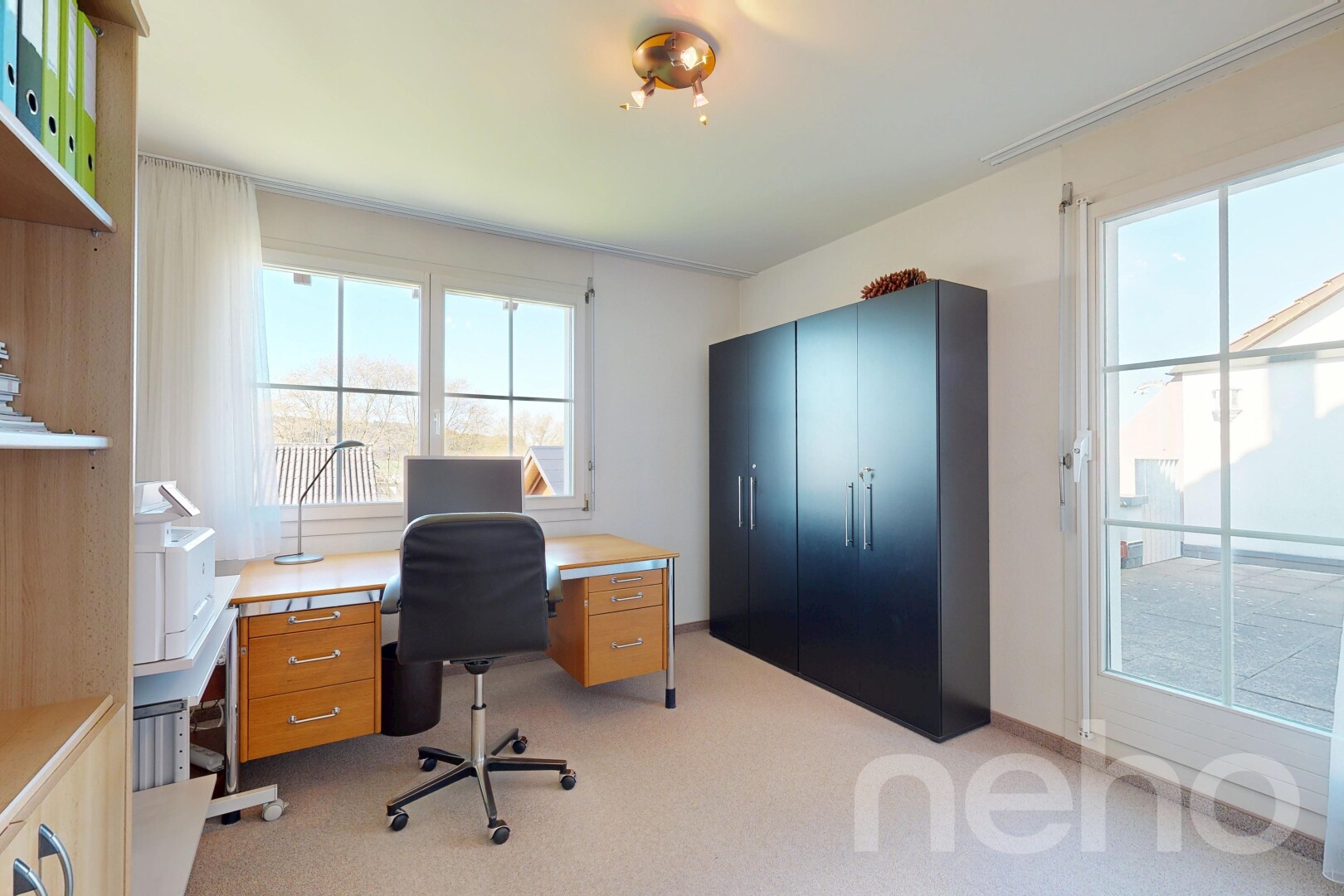 home office featuring light carpet and plenty of natural light