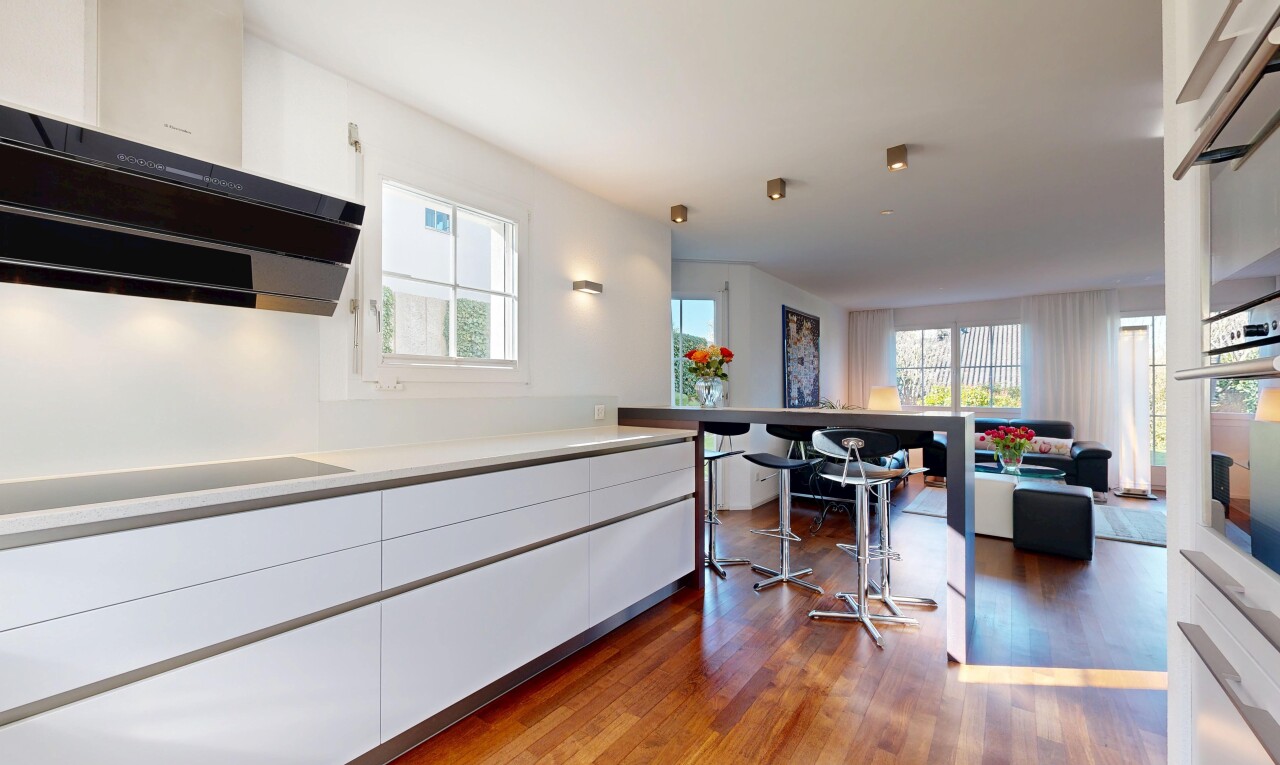 kitchen featuring white cabinets, light countertops, dark wood finished floors, and plenty of natural light