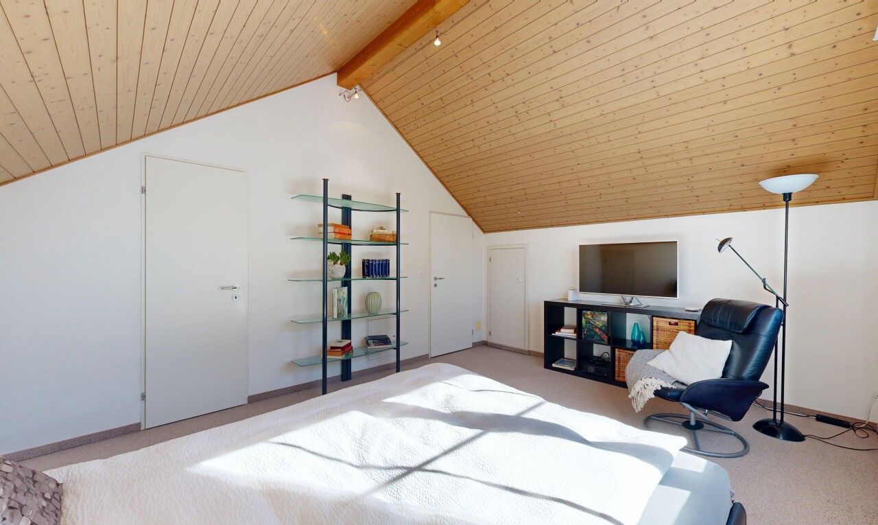 room featuring a wood ceiling with exposed beams and light colored carpet