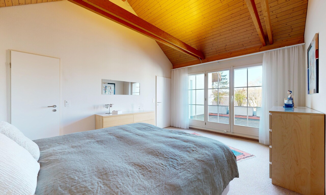 room with access to outside, light carpet, and a high wood beamed ceiling