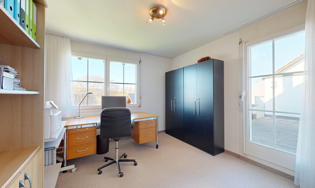 home office featuring light carpet and plenty of natural light
