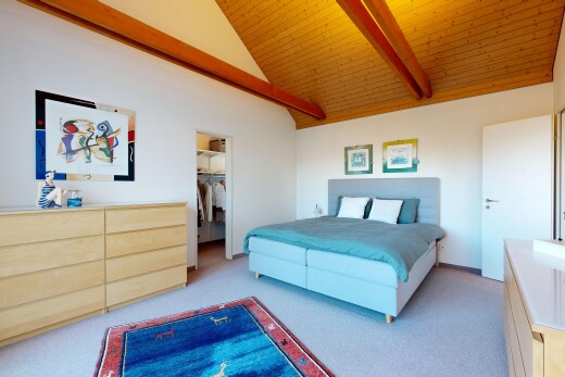 zimmer / schlafzimmer mit teppich, carpet, gipskartonwand, drywall, und inside property