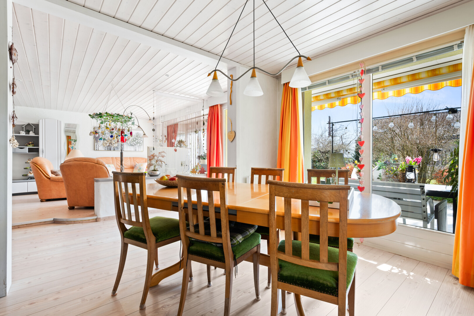 dining room featuring light wood finished floors and wooden ceiling