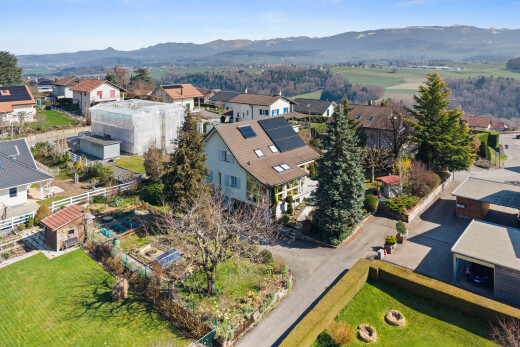 view of building exterior featuring a residential view and a mountain view