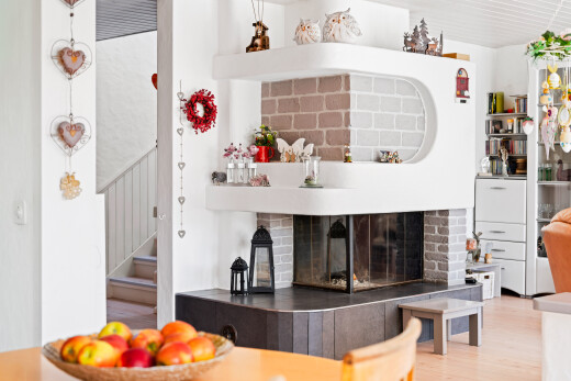 kitchen featuring a fireplace and wood finished floors