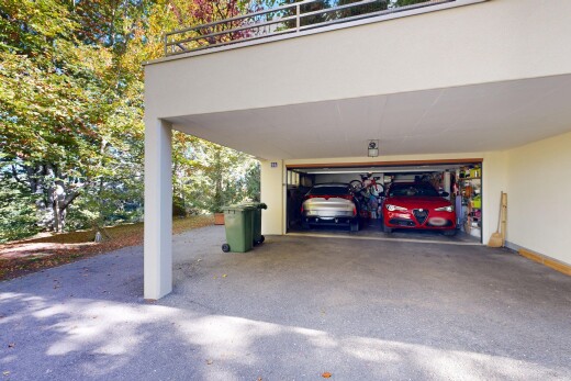 view of parking featuring driveway