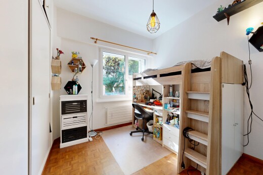 office featuring parquet floors, radiator, and hanging light fixtures
