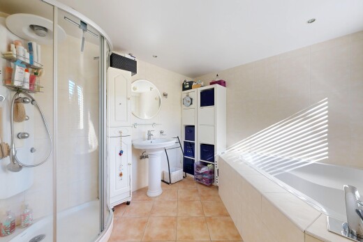 full bathroom with a stall shower, light tile patterned flooring, and a bath