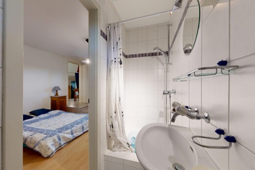 bathroom with hanging light fixtures