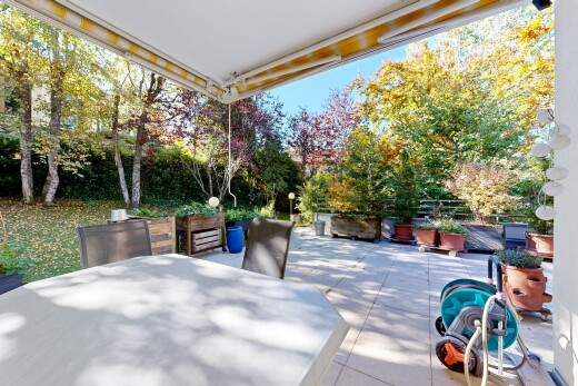 terrace featuring outdoor dining space and a patio
