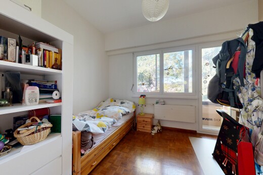 room / bedroom featuring parquet floors and built in shelves