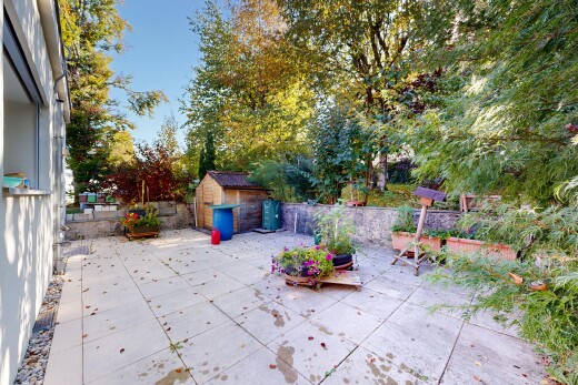terrace featuring a storage unit and a patio