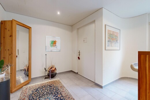 couloir avec éclairage encastré, drywall, cloison sèche, inside community, et light floor