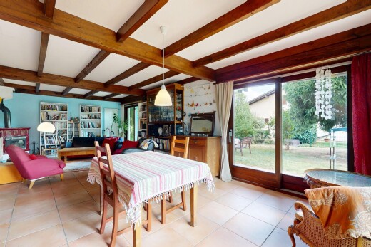 tiled dining room with beam ceiling