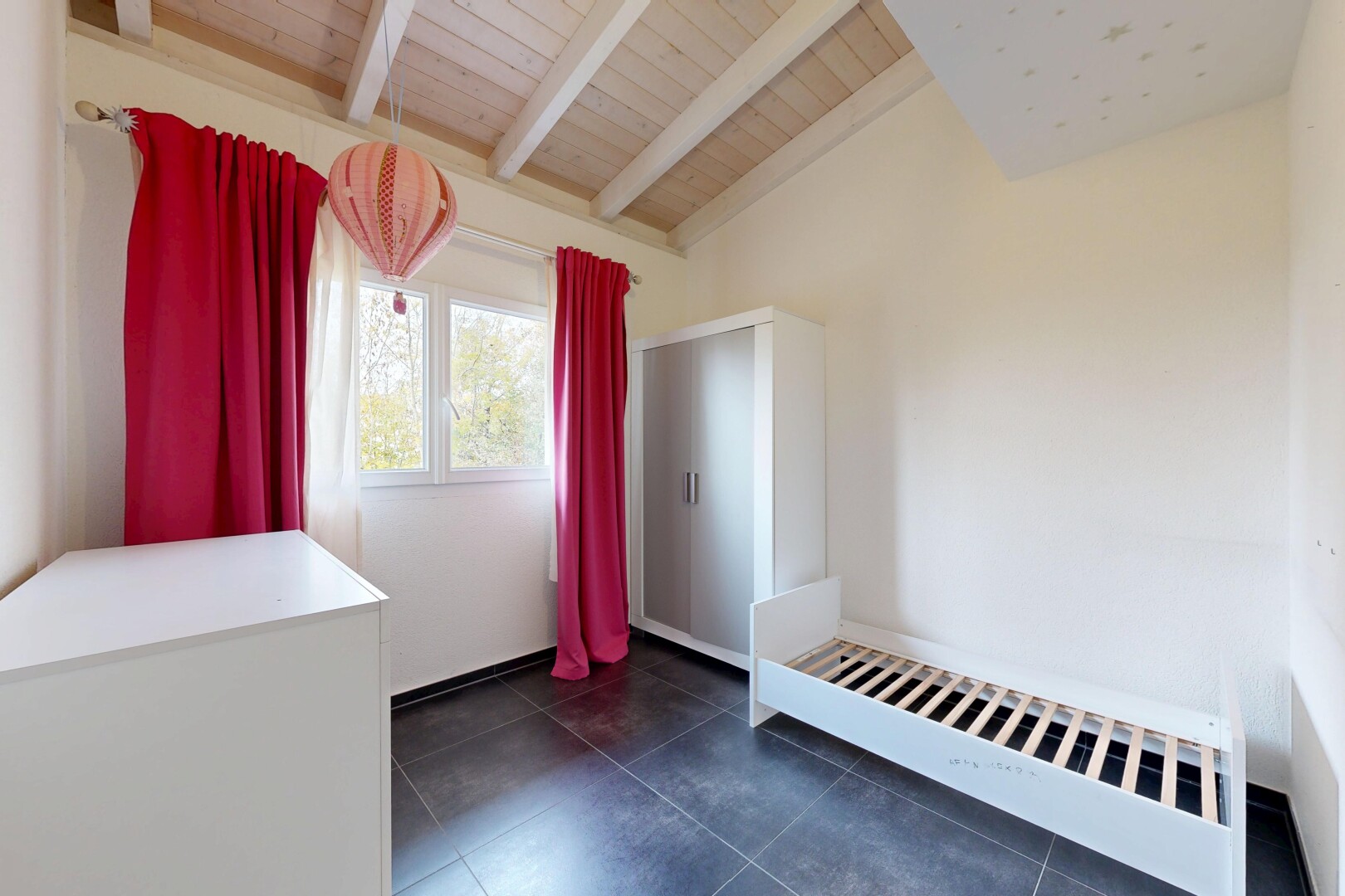 unfurnished room with wooden ceiling and dark tile patterned flooring