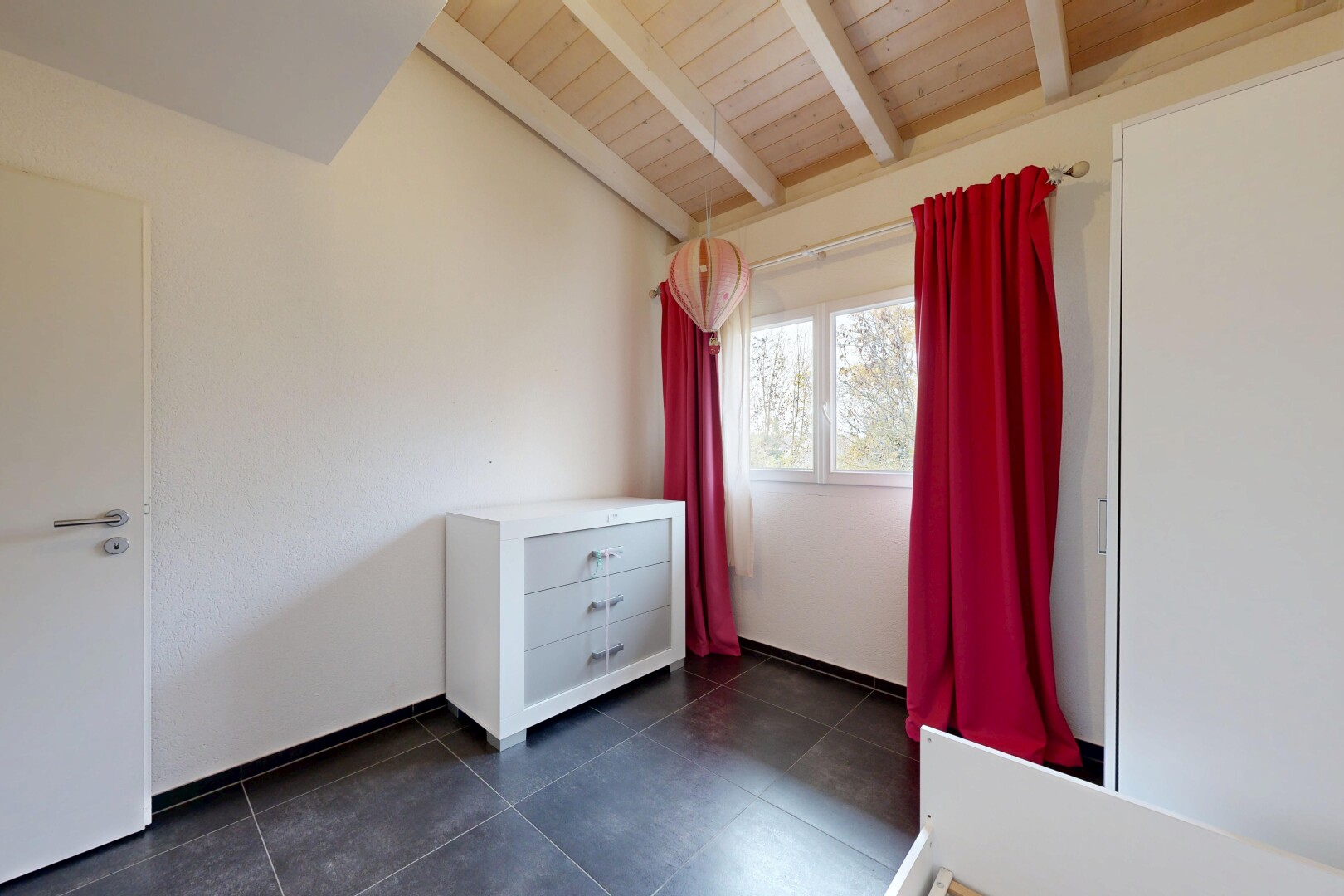 unfurnished room with dark tile patterned flooring and wood ceiling
