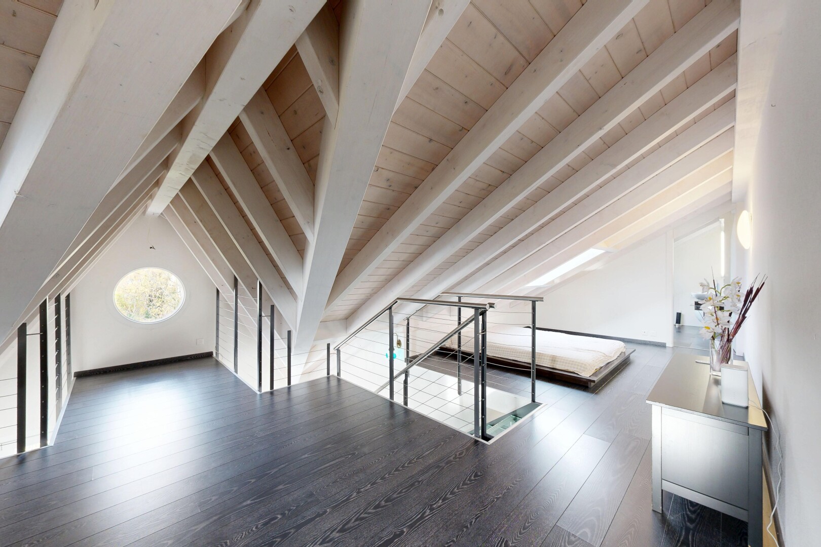 empty room with dark wood-style floors and wood ceiling