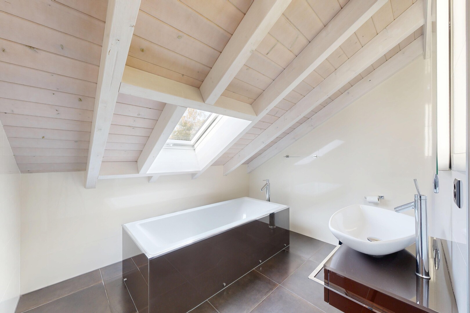 bathroom featuring a skylight, a bath, dark tile patterned flooring, and wood ceiling