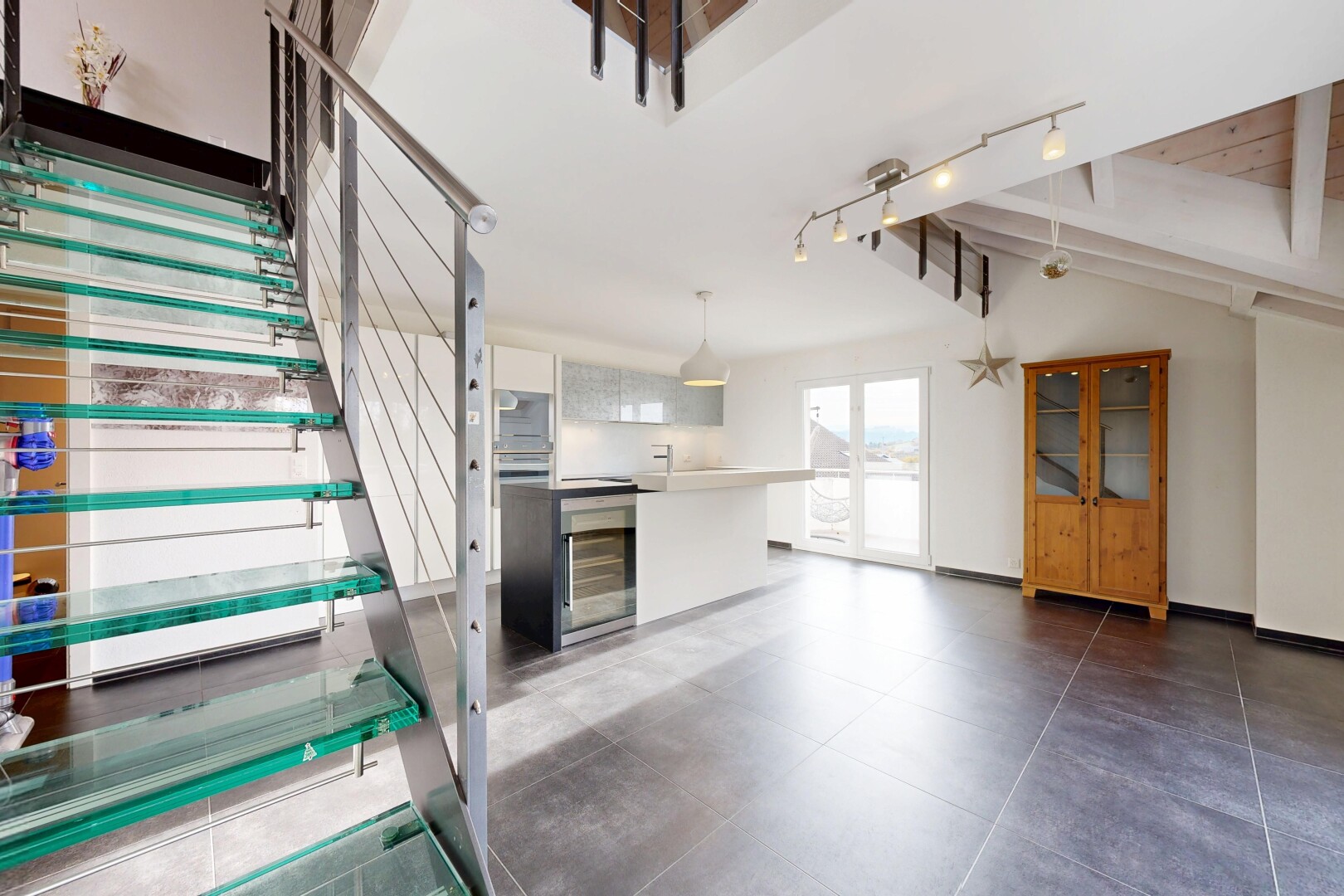stairway featuring wine cooler