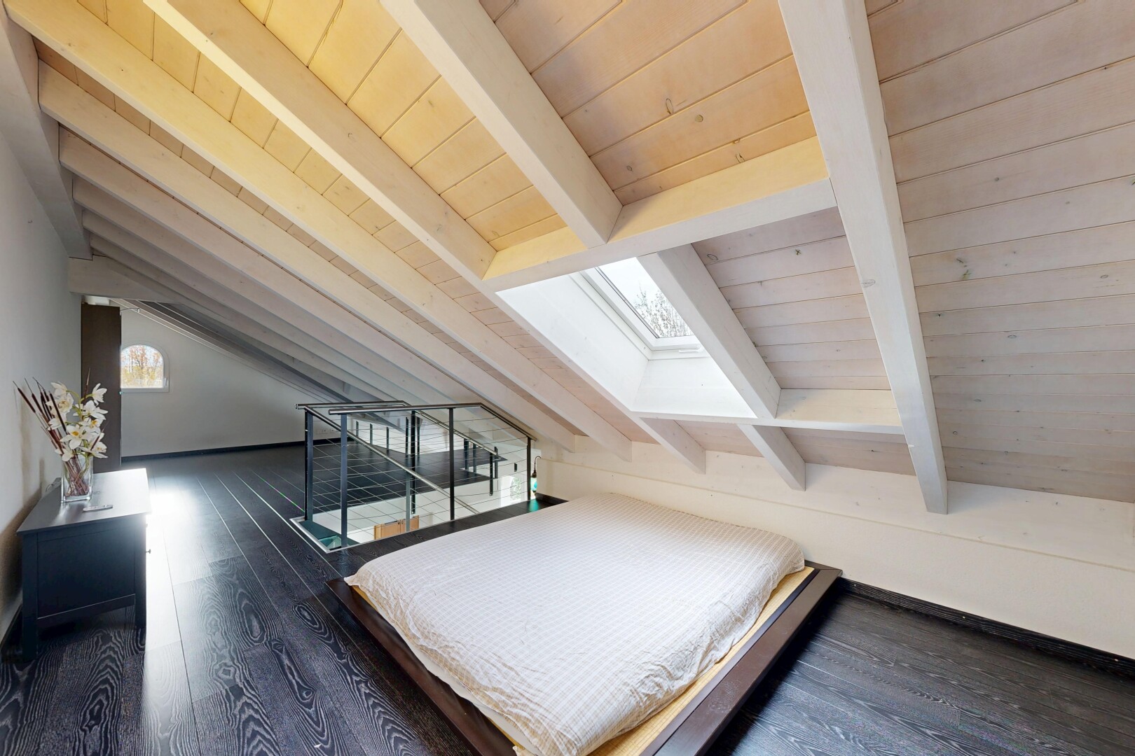 room / bedroom with dark wood finished floors, a skylight, and wooden ceiling
