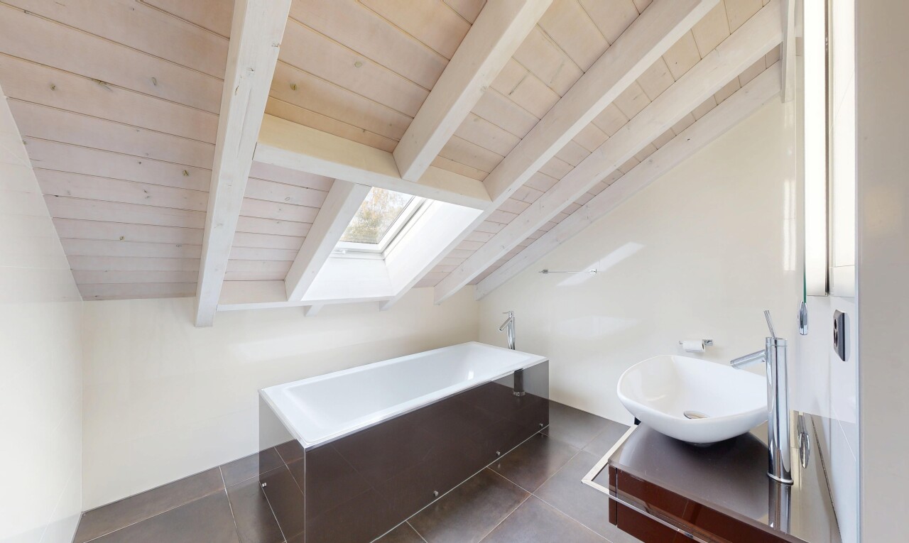 bathroom featuring a skylight, a bath, dark tile patterned flooring, and wood ceiling