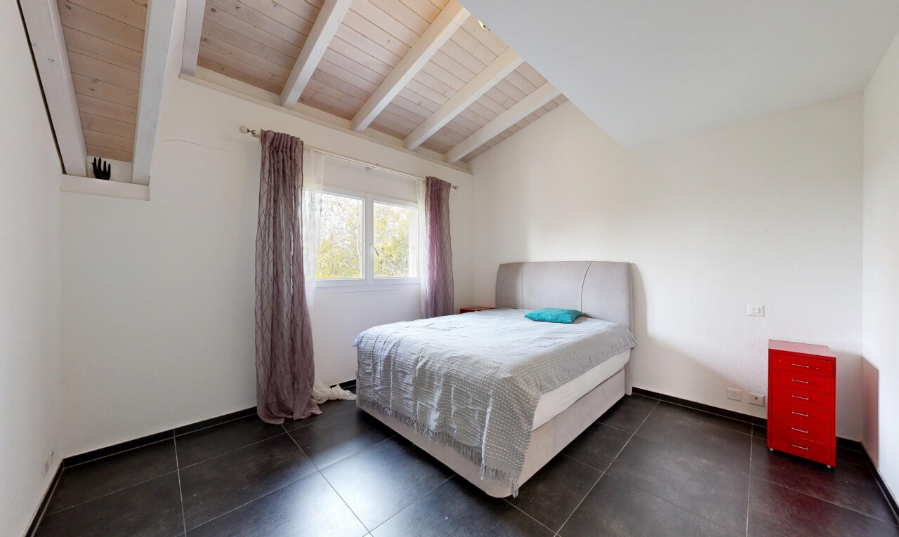 room featuring dark tile patterned floors and wooden ceiling