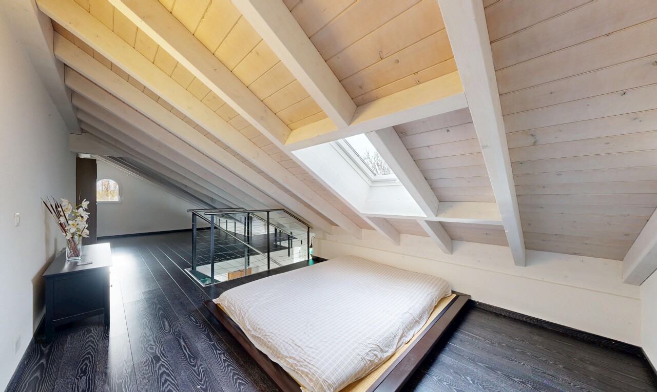 room / bedroom with dark wood finished floors, a skylight, and wooden ceiling