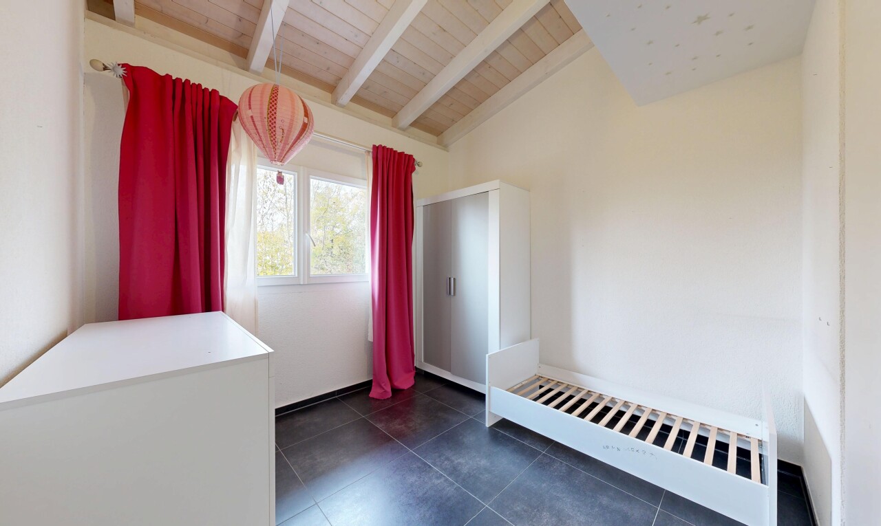 unfurnished room with wooden ceiling and dark tile patterned flooring