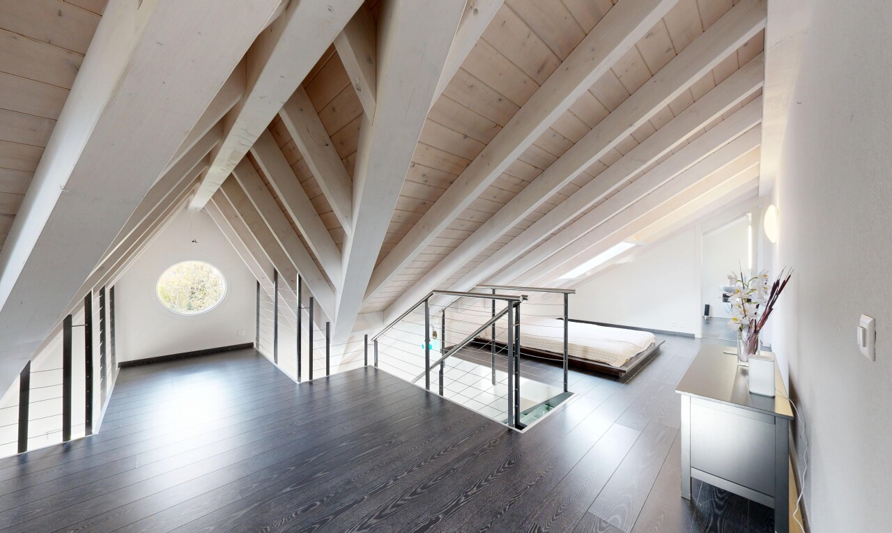 empty room with dark wood-style floors and wood ceiling