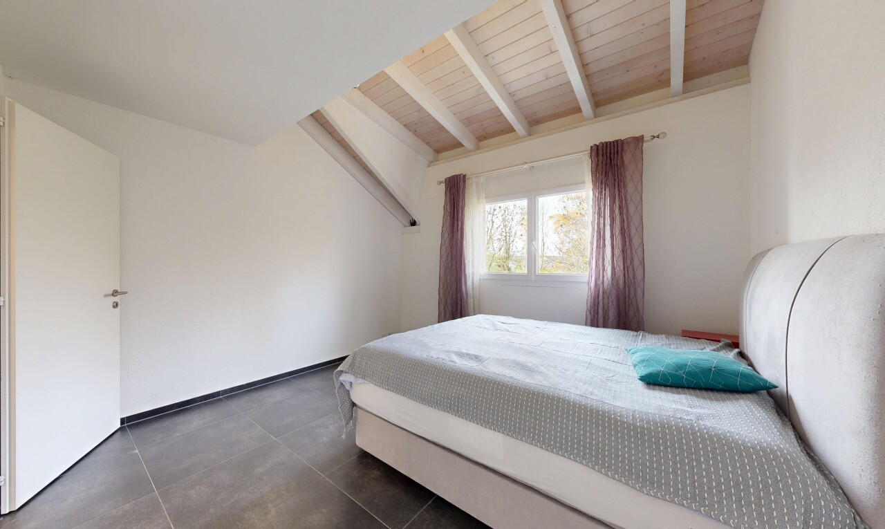 room featuring a wood ceiling with exposed beams