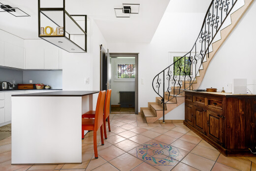 dining room featuring stairs, light tile patterned floors, and radiator heating unit