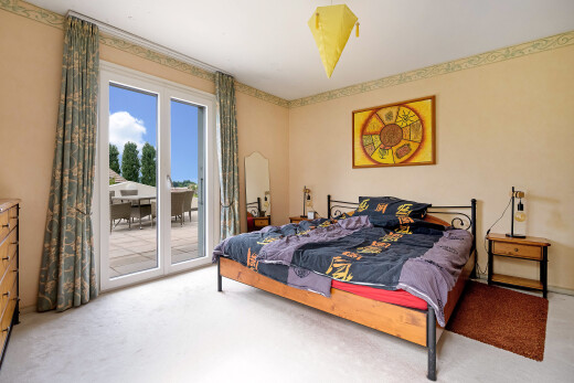 room featuring access to exterior and light carpet