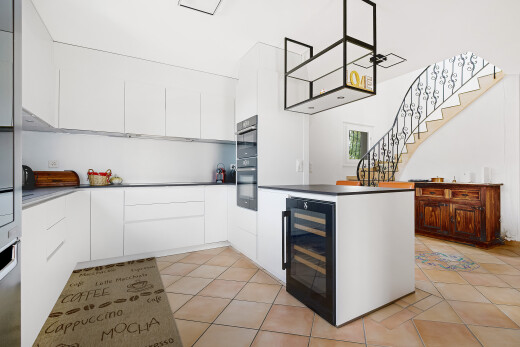 kitchen featuring white cabinets, modern cabinets, and light tile patterned floors