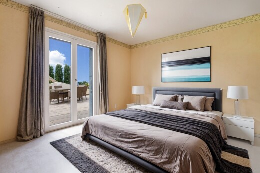 room featuring access to exterior and light carpet
