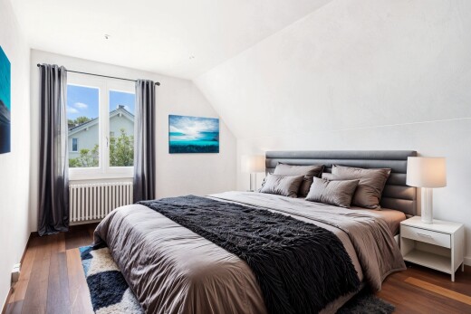 room with lofted ceiling, radiator, and dark wood-style floors